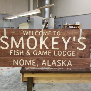 Engraved and stained spruce film sign